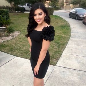 Elegant black dress with flower detail